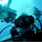 3 people diving in curacao